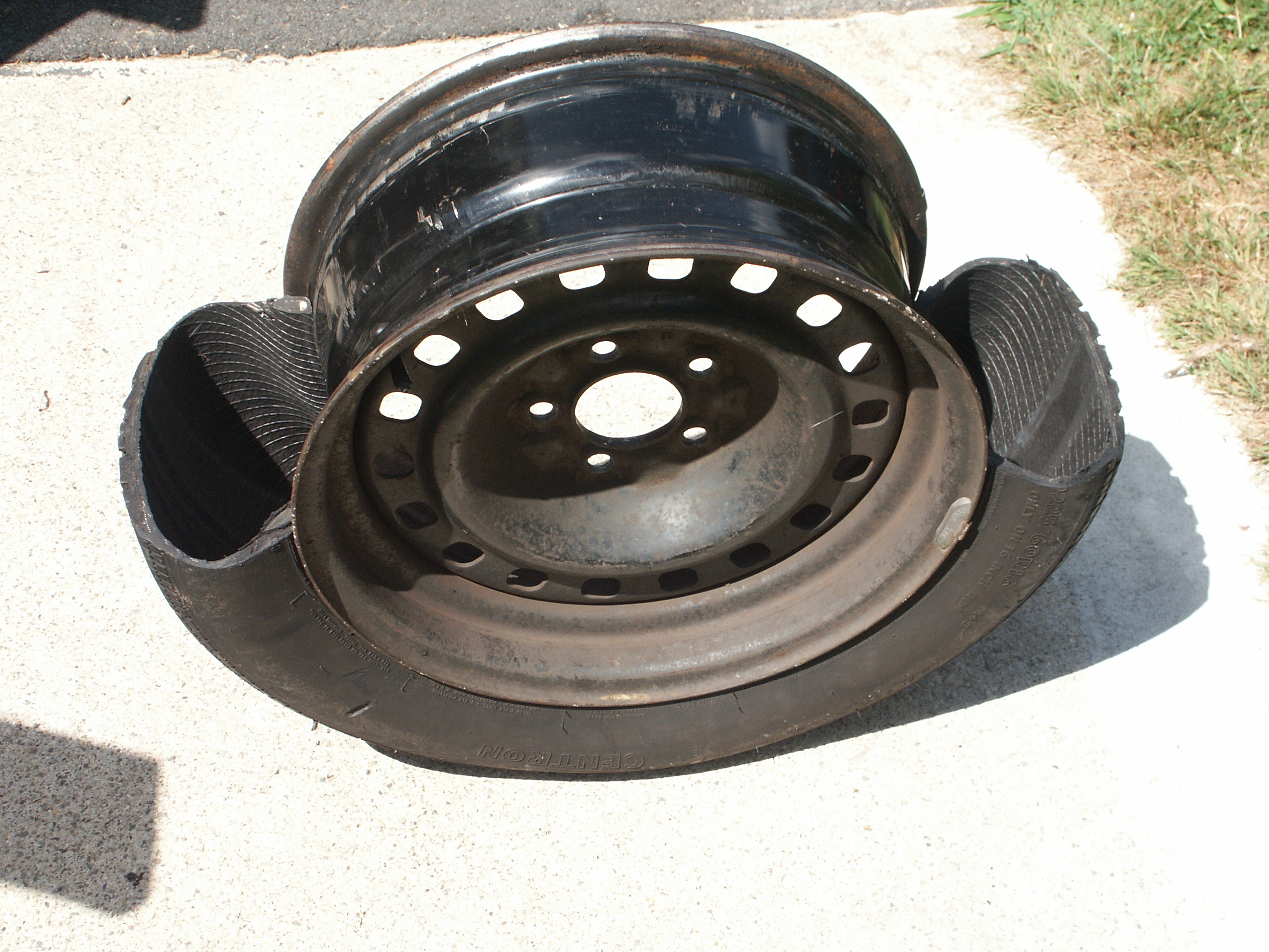 Cutting Apart A Steel Belted Radial Car Tire